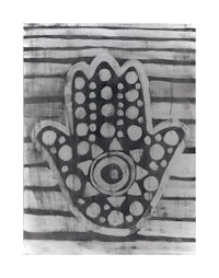 a black and white print of a hamsa hand